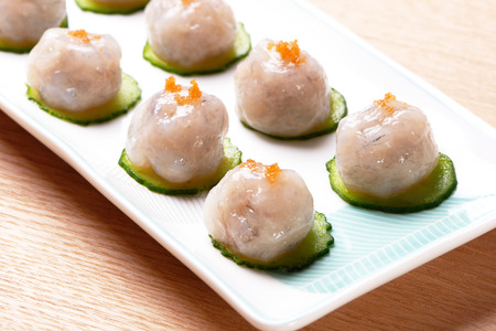 Fresh hand made shrimp ball in a white dishの写真素材