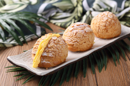 durian puffs in a black dish