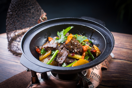Stir fried beef in a dark potの写真素材