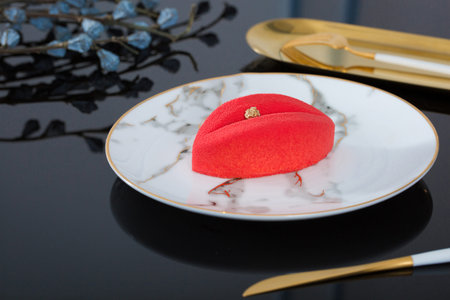 Delicate red leaf cake in a white dish