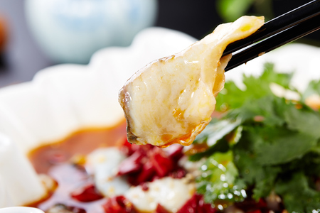 Boiled fish with bean sprouts in hot chili oilの写真素材