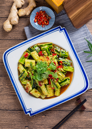 Sour and spicy cucumber salad in a ceramic dishの写真素材