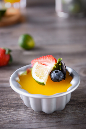 Roast mango pudding in a tin foil dishの写真素材