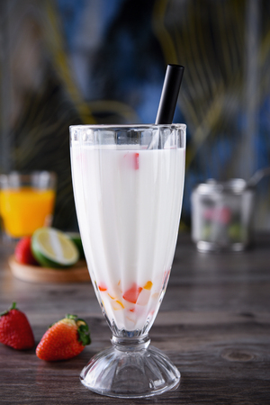 Strawberry coconut milk in a transparent glassの写真素材