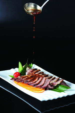 Angus beef sliced on a white dishの写真素材