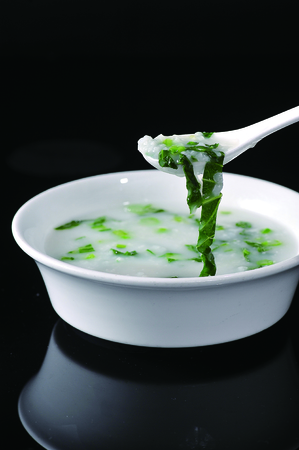 Vegetables porridge in a white potの写真素材