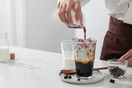 Brown sugar vanilla pearl milk tea in a clean glassの写真素材