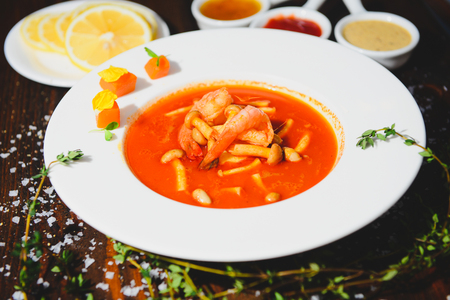 Thai seafood soup in a white dishの写真素材