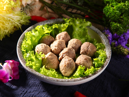 Handmade beef meatballs in a ceramic dishの写真素材