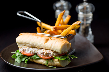 Tuna fish sandwich in a black dishの写真素材