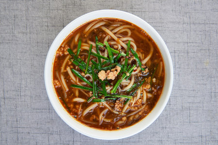 Spicy rice noodle in a white bowl