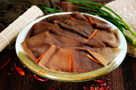 Fresh dark tripe slice in a ceramic dishの写真素材