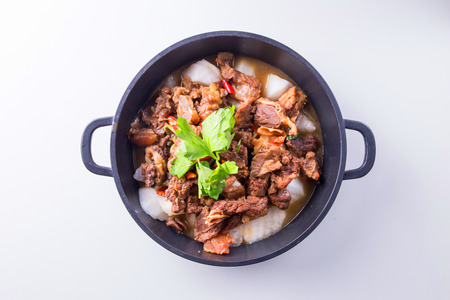 Boil turnip and beef in a dark tenderloin potの写真素材