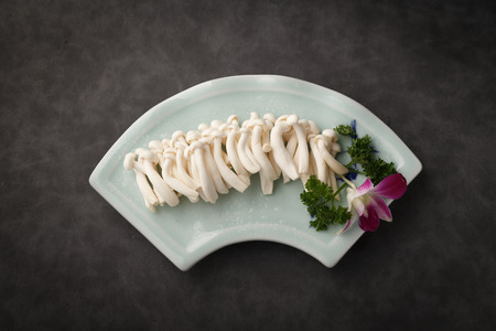 Freshly picked mushrooms in the ceramic dishの写真素材