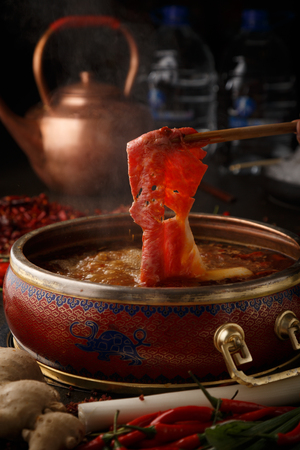 A piece of beef into the hot potの写真素材