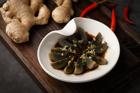 Preserved egg cold and dressed with sauceの写真素材