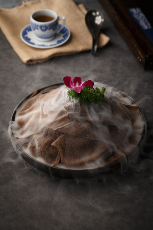 Fresh beef tripe in the black ceramic dishの写真素材