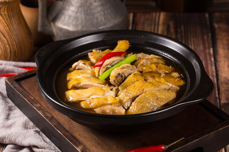 Stewed chicken with rice wine in a black ceramic dishの写真素材