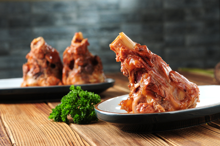 Hand-grasped spiced bone in a ceramic dishの写真素材