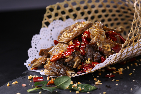 spicy lamb dish with cumin in a bamboo weaving dishの写真素材