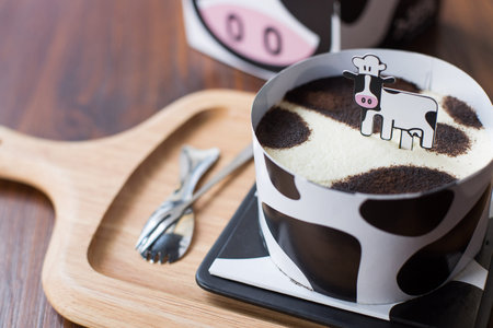 Minced milk cow cake on a wooden dish