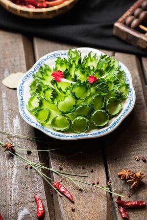 Fresh green cucumber rolls in a white ceramic dishの写真素材