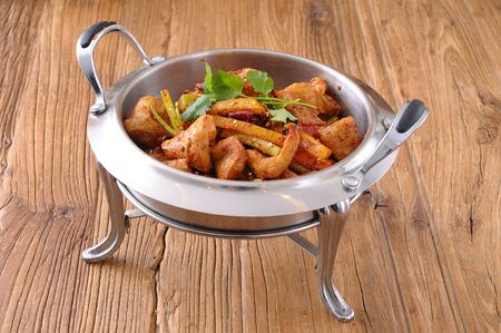 Spicy pot meat in a iron utensilsの写真素材