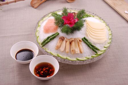 Cold sashimi platter with ice in a ceramic dishの写真素材