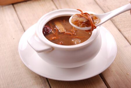 Sea food and poultry in a white ceramic dishの写真素材