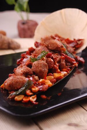 Spareribs with capsaicin in a black ceramic dishの写真素材