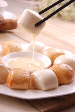 Steamed bun fried bun in a white ceramic dishの写真素材