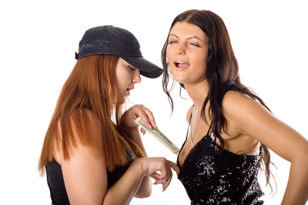 woman with dollars rewards other womanの写真素材