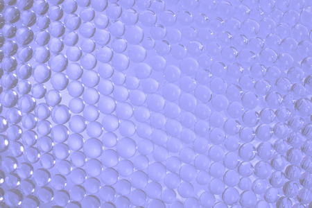 Background of glass beads in blue with highlights. Stock image.の写真素材