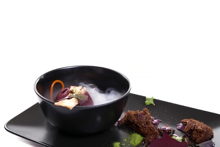 Molecular Cuisine. Delicious modern soup with beetroot. Isolated on white. Stock image.の写真素材