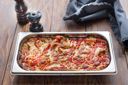 Hot tasty lasagna in ceramic casserole dish
