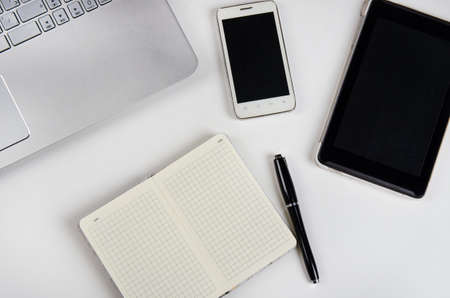 table with laptop and notebookの写真素材