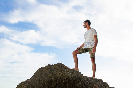 Male backpacker standing on the top