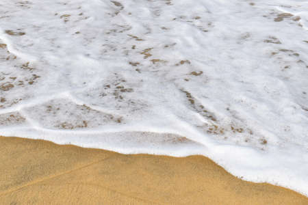Tropical Sand beach background with long sand beach blue ocean and sky horizon india kerala varkalaの写真素材