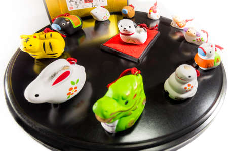 Twelve animals to decorate on New Year's Day in Japan (the central animal is the main character of the year) The letters written behind represent the names of twelve kinds of animals.の写真素材