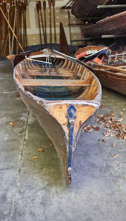 Old wooden boat on the ground in the old town of Riga, Latviaの写真素材