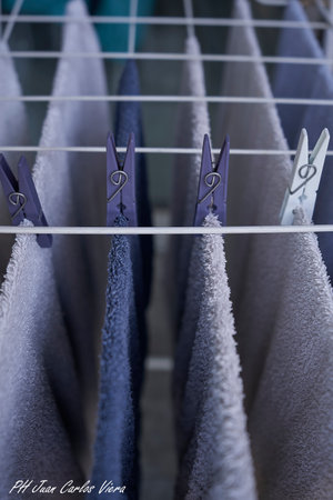 Clothes drying on a clothesline in a clothing store, close upの写真素材