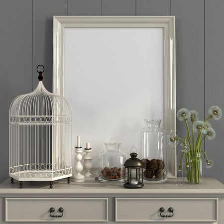 Cozy interior in a light gray color with a beige table, poster frame and autumn decorationsの写真素材