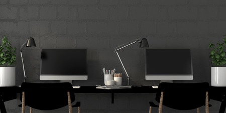 The working area in the interior with two computersの写真素材