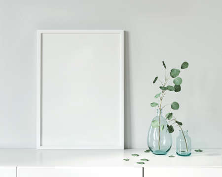 Poster on a white chest of drawers near a glass you with a branch / 3D illustration, 3d renderの写真素材