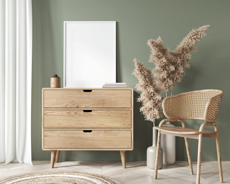 Mockup interior in boho style with rotan chairs, vase with dry wheat and white frame on wooden chest...