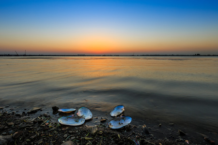 The lake under the setting sunの写真素材