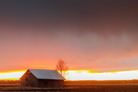 The sunset colored the clouds red. The springtime sunsets can be pretty dramatic in the Northern Finland but this one was quite spectacular.の写真素材