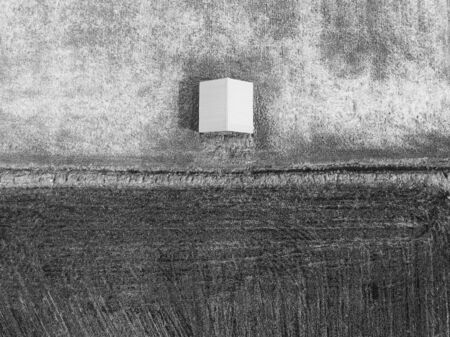 An above view of a barn house by the fields at the Northern Finland. The fields are waiting for the farmers after the long winter.の写真素材