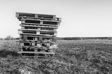The farmer has left a pile of wooden pallets on the fields. They may be waiting for the potato crates.の写真素材