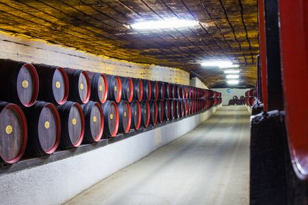 Moldavia, Chisinau may 2018: storage barrels in the famous cellars of the winery, at a constant temperature 10 degrees and humidity. Cricova winery with 120 km of underground passages for wine storageのeditorial素材